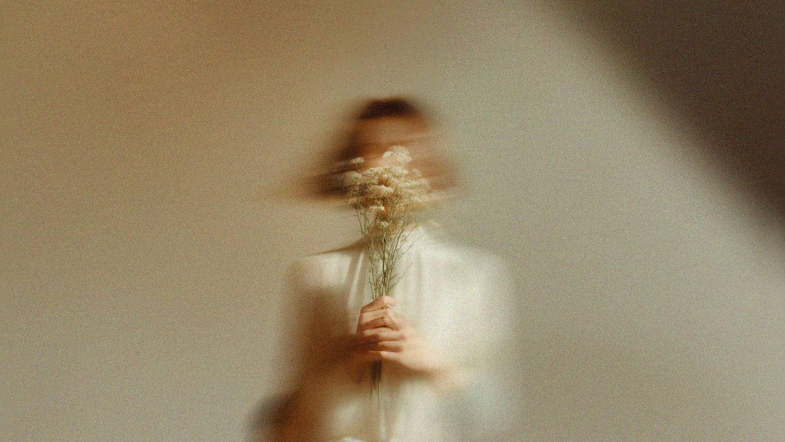 Woman holding wildflowers
